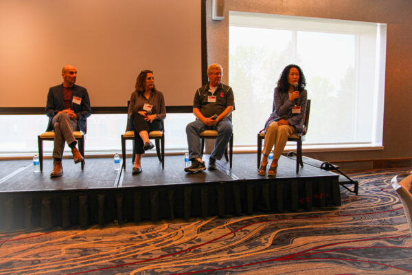 Panelists during the "Building Bridges from Scientific Discovery to Societal Impact"